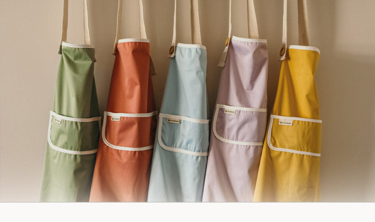 Vijf Smikkels kinderschorten in de kleuren groen, roze, blauw, lila en geel